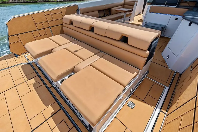  Yacht Photos Pics Luxurious seating on 2022 Aviara AV40 OB boat with tan upholstery and sleek design.