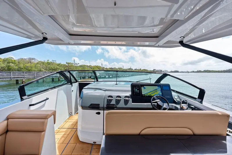  Yacht Photos Pics 2022 Aviara AV40 OB boat interior with modern dashboard and scenic water view.