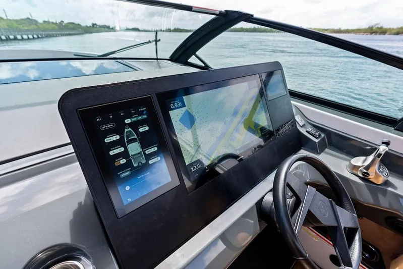  Yacht Photos Pics 2022 Aviara AV40 OB boat dashboard with advanced navigation screens and steering wheel.