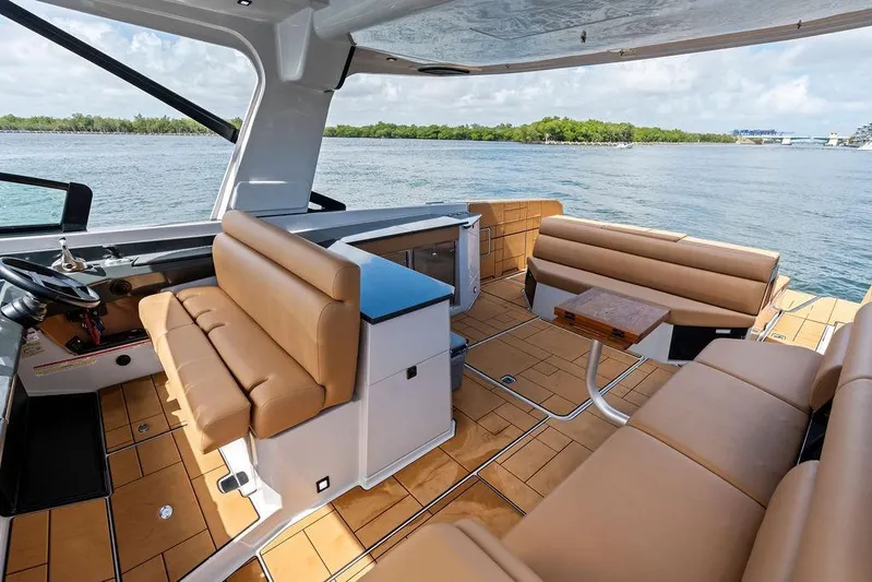  Yacht Photos Pics Luxurious 2022 Aviara AV40 OB boat interior with tan seating and scenic water view.
