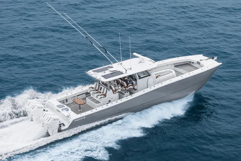  Yacht Photos Pics 2024 Freeman 47 yacht cruising on open ocean, showcasing sleek design and powerful engines.