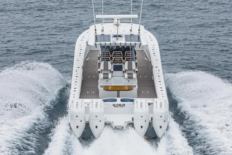  Yacht Photos Pics 2024 Freeman 47 boat with four engines cruising on open water.