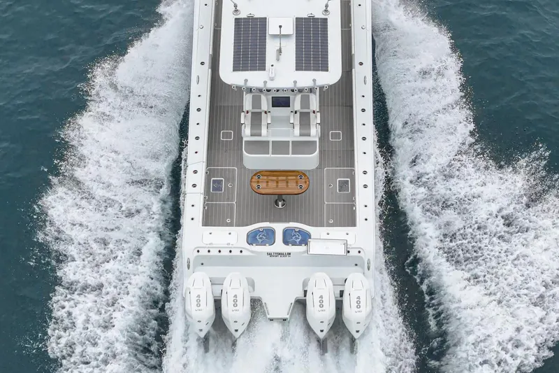  Yacht Photos Pics Aerial view of 2024 Freeman 47 boat cruising on water with four engines.