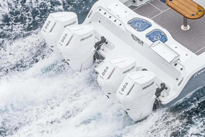  Yacht Photos Pics Freeman 47 boat with four Mercury outboard engines, 2024 model, cruising through water.