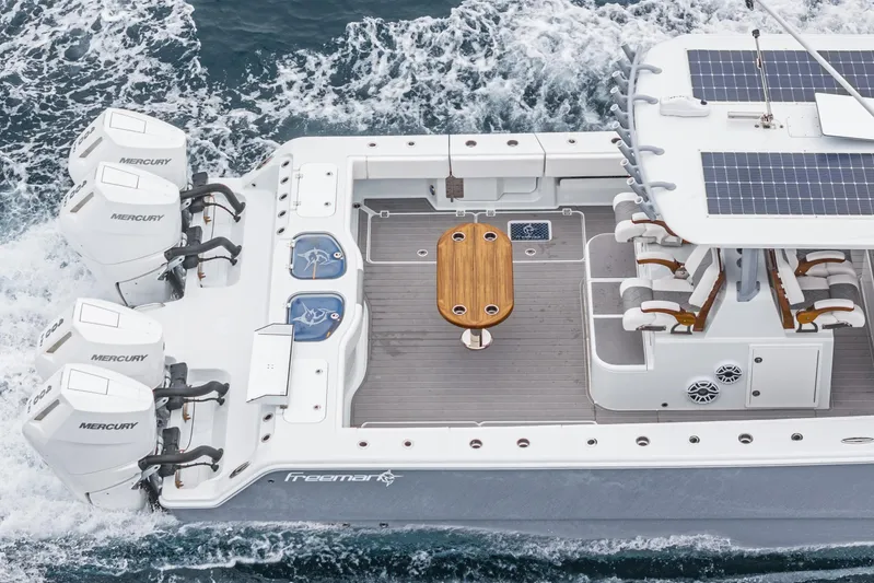  Yacht Photos Pics 2024 Freeman 47 boat with Mercury engines, solar panels, and spacious deck on the water.