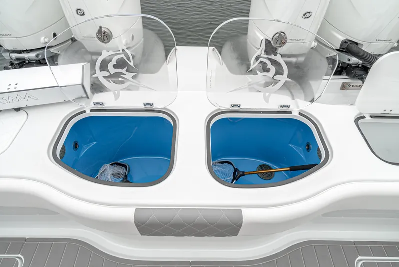  Yacht Photos Pics 2024 Freeman 47 boat with dual livewells and fishing nets, featuring sleek design and powerful engines.