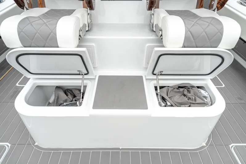 Yacht Photos Pics 2024 Freeman 47 boat interior with open storage compartments and cushioned seating.