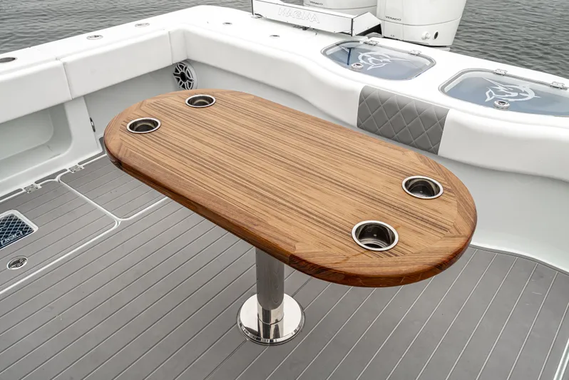  Yacht Photos Pics Luxury boat deck with wooden table, Freeman 47 model, 2024.