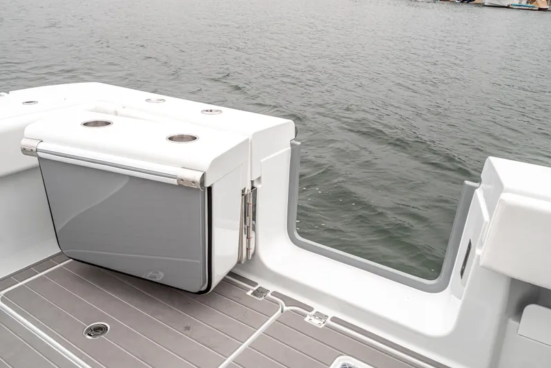  Yacht Photos Pics 2024 Freeman 47 boat deck with storage compartment, overlooking calm water.