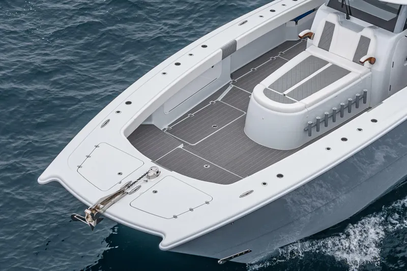  Yacht Photos Pics 2024 Freeman 47 boat on water, showcasing sleek design and spacious deck.