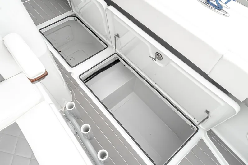  Yacht Photos Pics 2024 Freeman 47 boat storage compartments with open lids, showcasing spacious interior design.