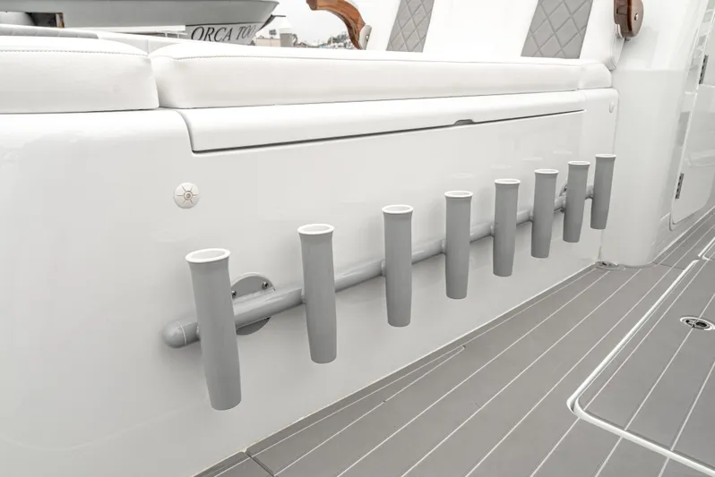  Yacht Photos Pics Rod holders on a 2024 Freeman 47 boat, featuring sleek white and gray design.