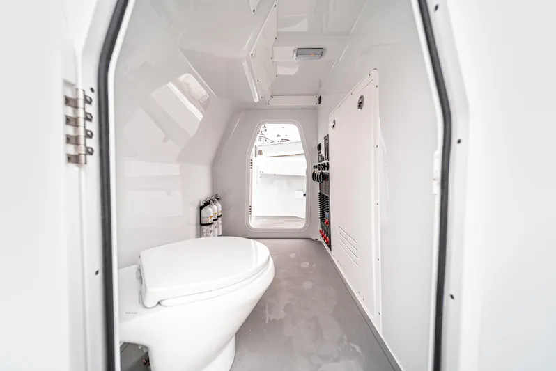  Yacht Photos Pics 2024 Freeman 47 boat interior with modern white bathroom and sleek design.