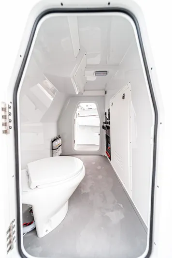  Yacht Photos Pics 2024 Freeman 47 boat interior with modern white bathroom and sleek design.