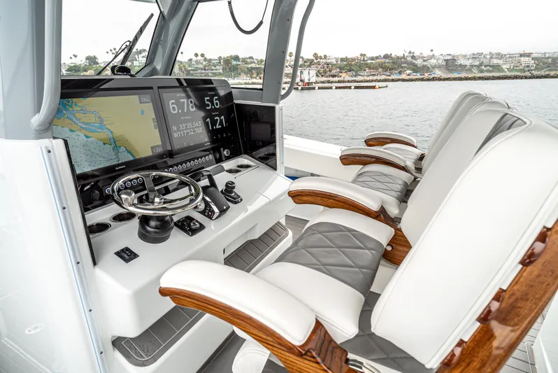  Yacht Photos Pics 2024 Freeman 47 boat cockpit with advanced navigation system and luxurious seating.