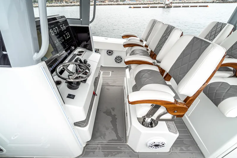  Yacht Photos Pics Interior of 2024 Freeman 47 boat with luxury seating and modern steering console.