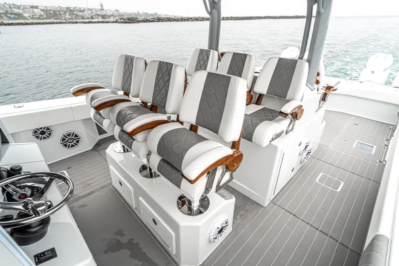  Yacht Photos Pics Luxurious seating on 2024 Freeman 47 boat with ocean backdrop.