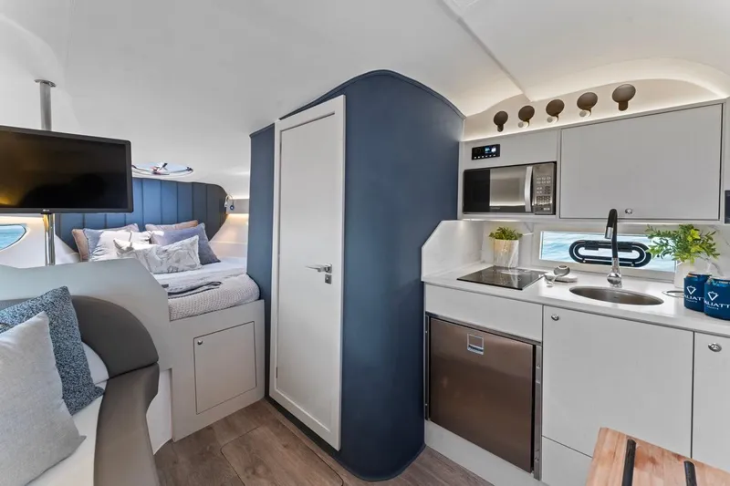  Yacht Photos Pics Luxurious interior of 2026 Valiatt 350 GT yacht with modern kitchen and cozy bedroom.