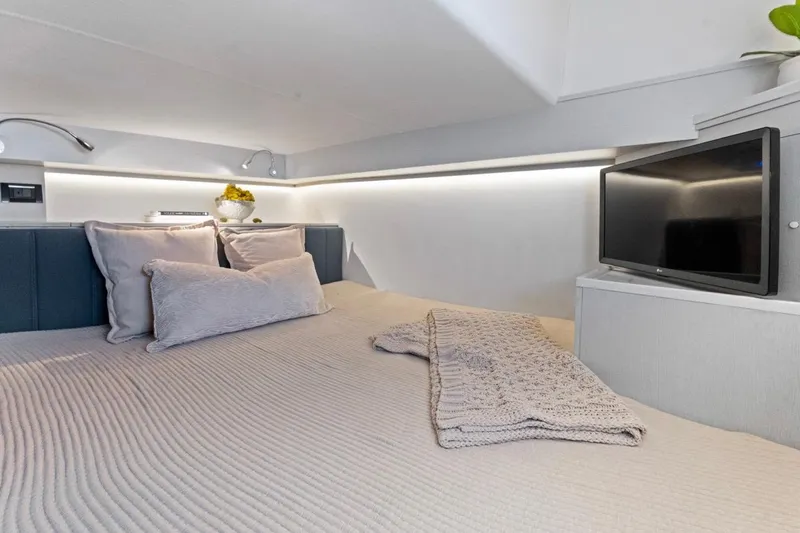  Yacht Photos Pics Luxurious interior of 2026 Valiatt 350 GT with cozy bedding and modern TV setup.