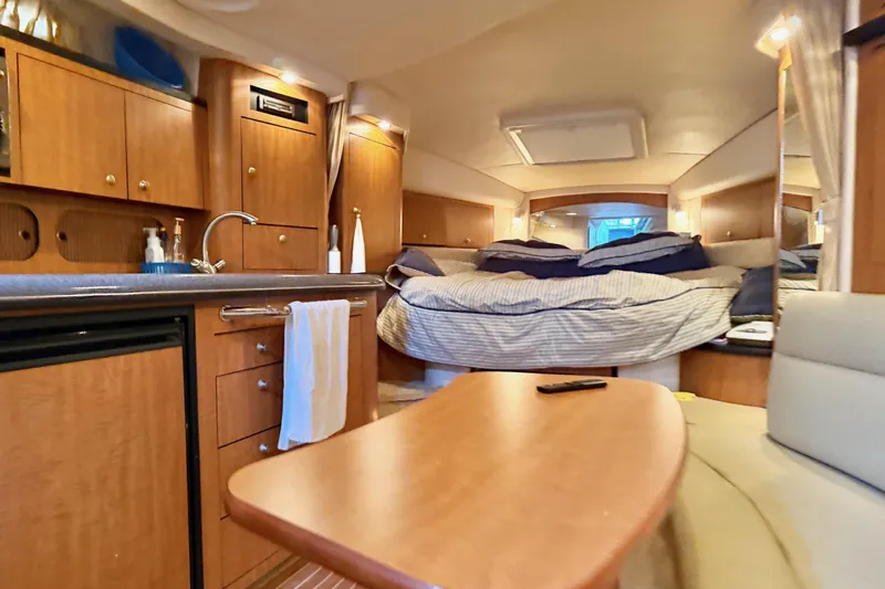  Yacht Photos Pics Interior of 2006 Sea Ray 340 Sundancer yacht with cozy cabin and kitchenette.