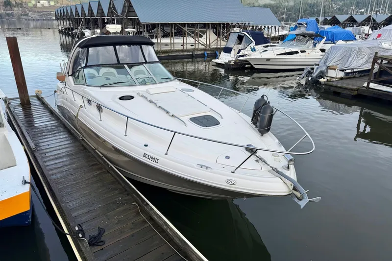  Yacht Photos Pics 2006 Sea Ray 340 Sundancer docked at marina, surrounded by other boats.