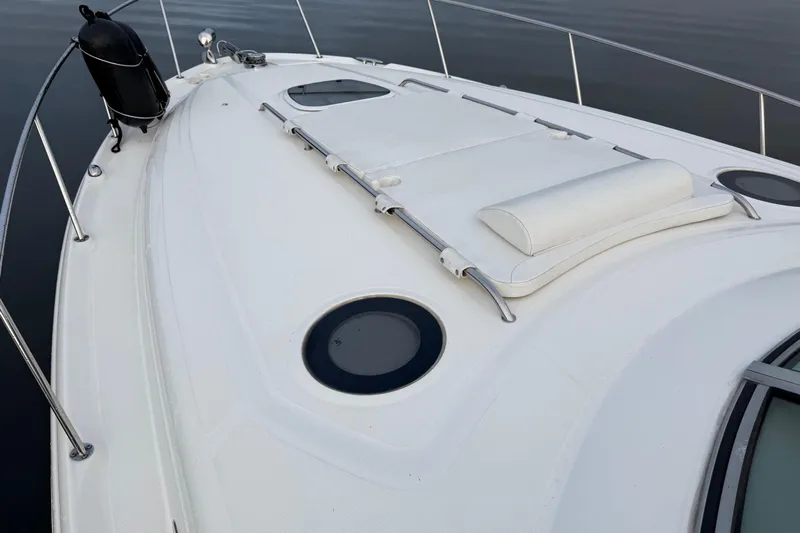  Yacht Photos Pics 2006 Sea Ray 340 Sundancer boat deck with white seating and circular windows.