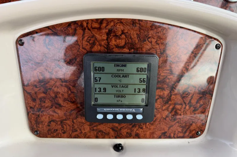 Yacht Photos Pics Dashboard of 2006 Sea Ray 340 Sundancer showing engine metrics on wood panel.