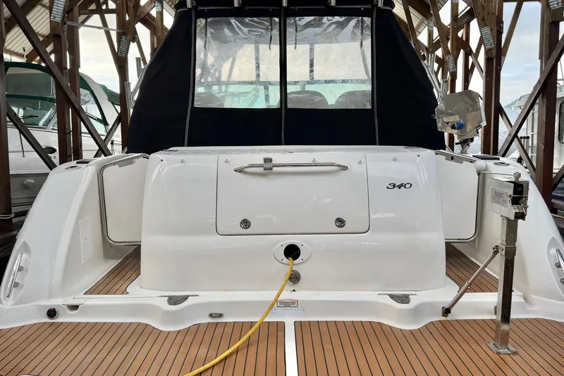  Yacht Photos Pics 2006 Sea Ray 340 Sundancer yacht docked, showcasing rear deck and cabin entrance.