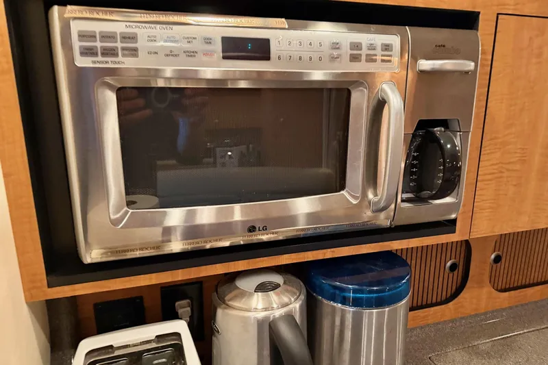  Yacht Photos Pics Built-in microwave and coffee maker in 2006 Sea Ray 340 Sundancer yacht kitchen.