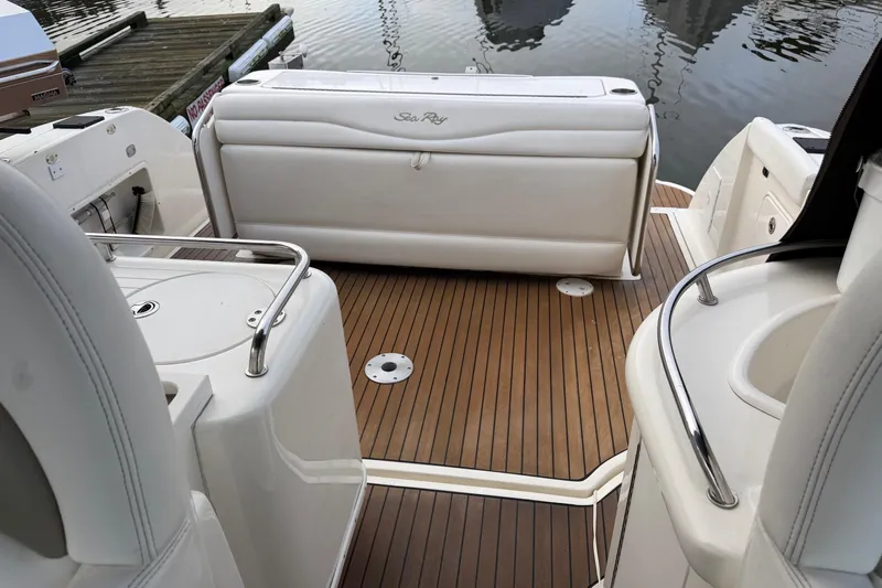  Yacht Photos Pics 2006 Sea Ray 340 Sundancer boat interior with teak flooring and white seating.