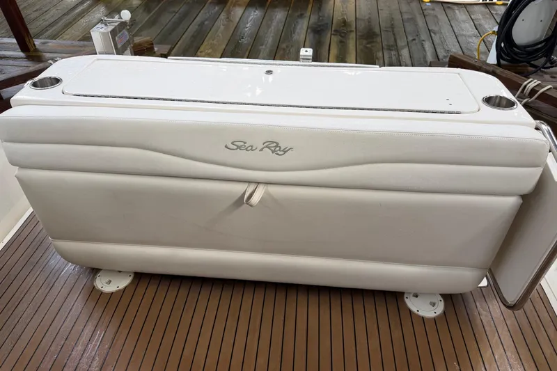 Yacht Photos Pics White Sea Ray 340 Sundancer 2006 boat seat on wooden deck.