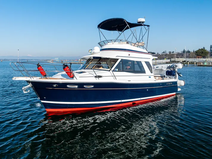 Awol Yacht Photos Pics 2016 Cutwater 30 Command Bridge boat on calm water, featuring a sleek design and vibrant colors.
