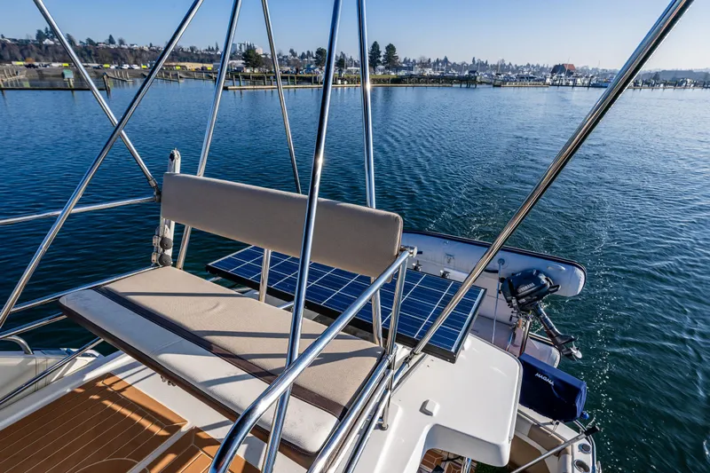 Awol Yacht Photos Pics 2016 Cutwater 30 Command Bridge on water, featuring solar panels and seating area.