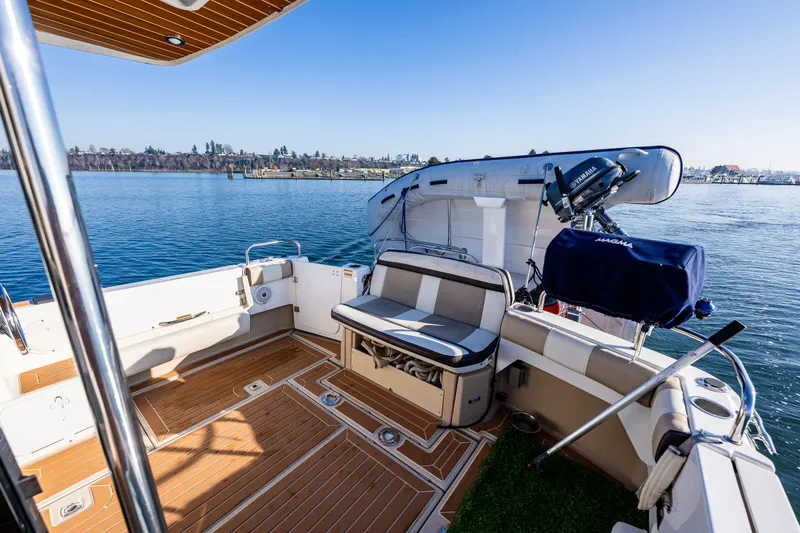 Awol Yacht Photos Pics 2016 Cutwater 30 Command Bridge boat with spacious deck and seating, docked on calm water.