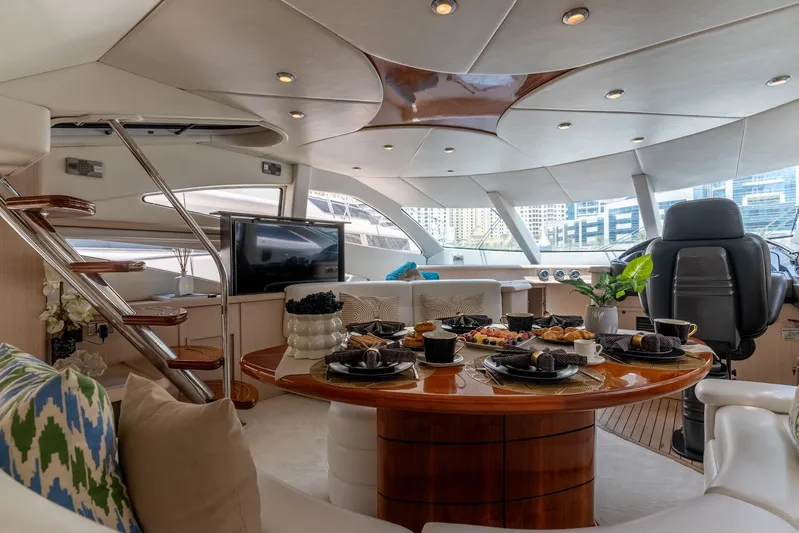 Java Yacht Photos Pics Luxurious interior of 2004 Sunseeker Manhattan 64 yacht with elegant dining setup.