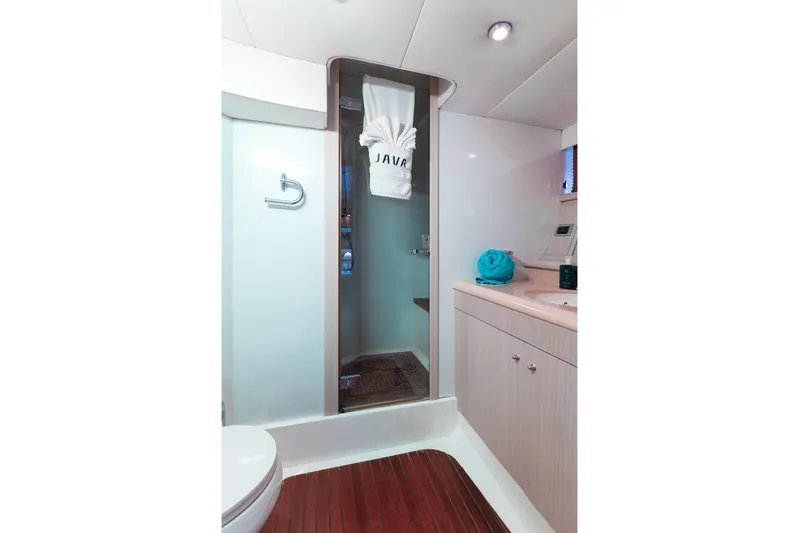 Java Yacht Photos Pics Luxurious bathroom in 2004 Sunseeker Manhattan 64 yacht, featuring modern amenities.