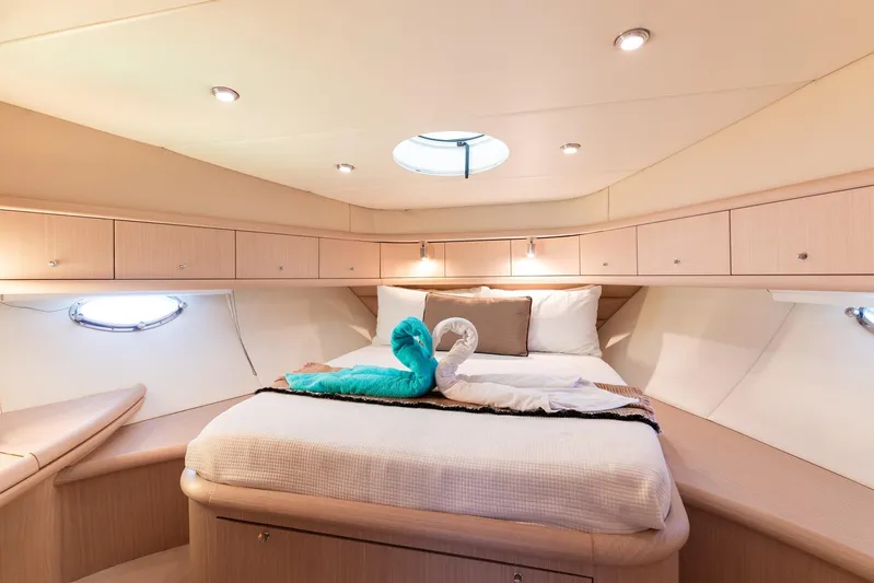Java Yacht Photos Pics Luxurious cabin interior of 2004 Sunseeker Manhattan 64 yacht with elegant bedding.