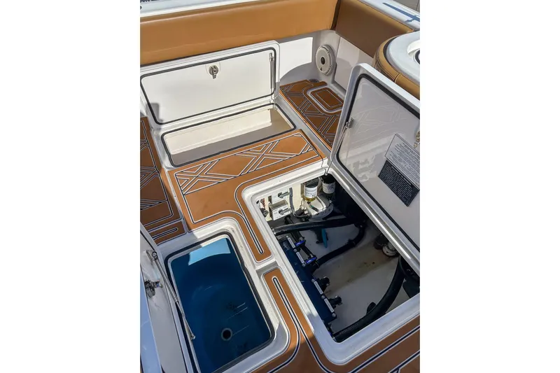  Yacht Photos Pics 2022 Invincible 39 Open Fisherman boat deck with open storage compartments.