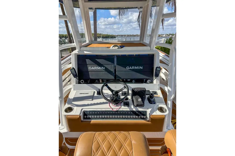  Yacht Photos Pics 2022 Invincible 39 Open Fisherman boat dashboard with Garmin displays and Mercury controls.