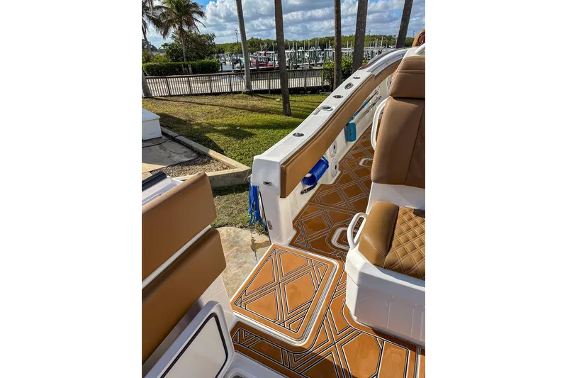  Yacht Photos Pics 2022 Invincible 39 Open Fisherman boat interior with brown seating and patterned flooring.