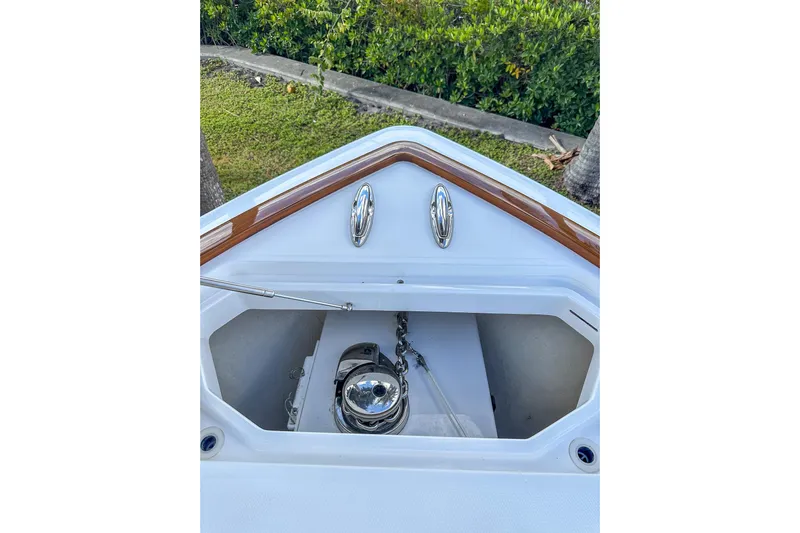  Yacht Photos Pics 2022 Invincible 39 Open Fisherman boat anchor compartment with polished metal fittings.