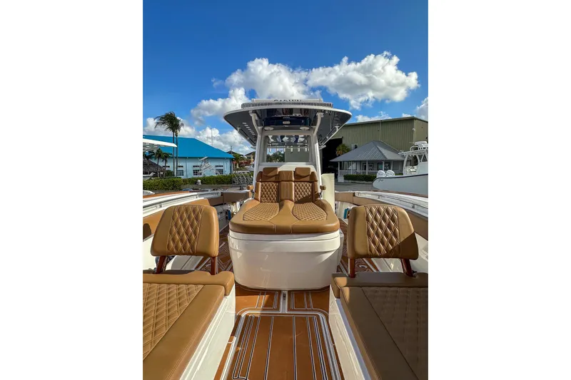  Yacht Photos Pics 2022 Invincible 39 Open Fisherman boat with luxurious seating and clear blue sky.
