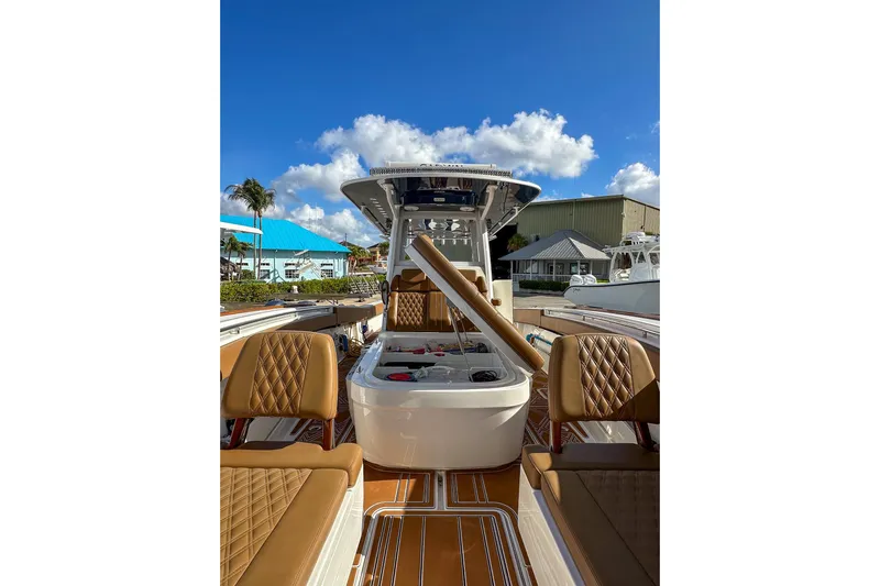  Yacht Photos Pics 2022 Invincible 39 Open Fisherman boat with luxurious seating and clear blue sky.