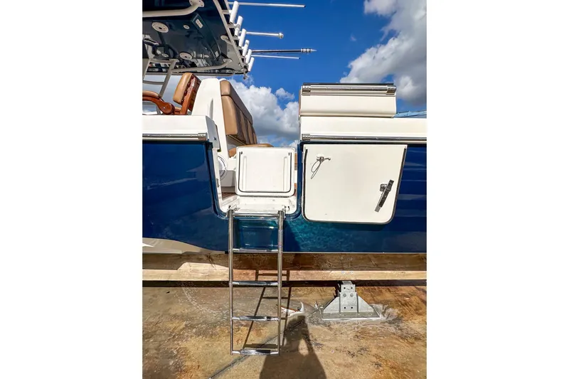  Yacht Photos Pics 2022 Invincible 39 Open Fisherman boat with ladder and storage compartments.