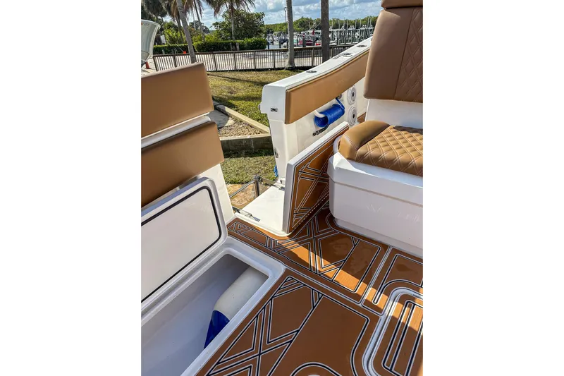  Yacht Photos Pics 2022 Invincible 39 Open Fisherman boat interior with stylish seating and patterned flooring.