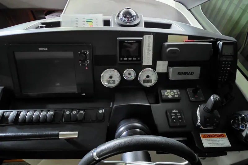  Yacht Photos Pics Control panel of 2014 Jeanneau NC 14 boat with navigation and communication equipment.
