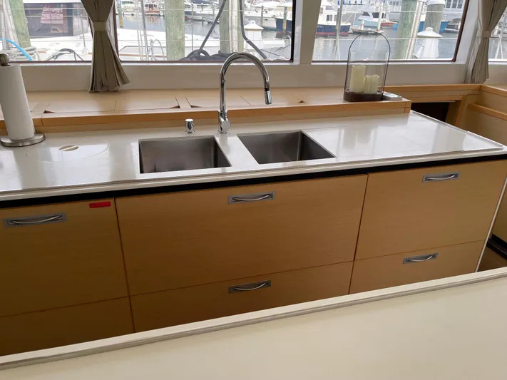 Phoenicia Yacht Photos Pics Interior of Lagoon 620 yacht kitchen, 2014 model, featuring double sink.