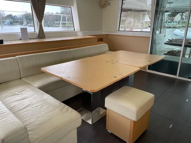 Phoenicia Yacht Photos Pics Interior of a 2014 Lagoon 620 yacht with modern dining area.