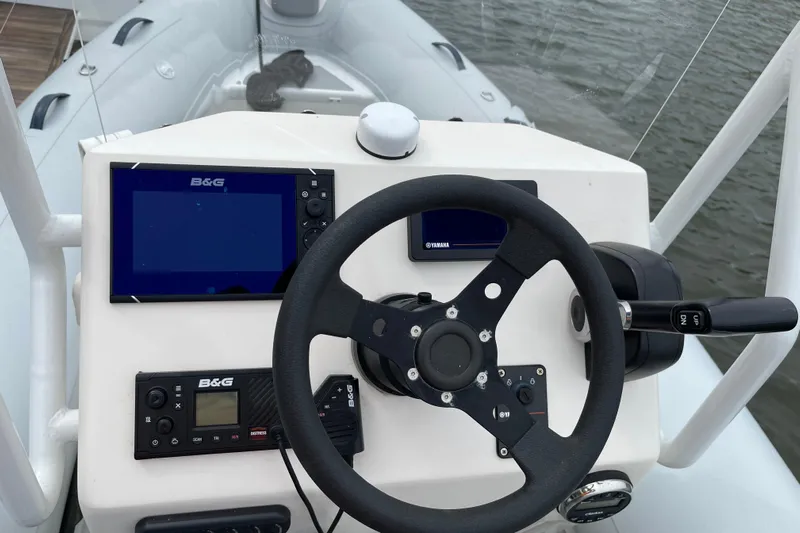 Phoenicia Yacht Photos Pics Steering console of 2014 Lagoon 620 yacht with navigation equipment and controls.