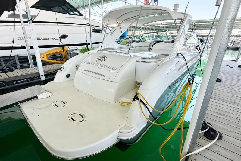 Obstreperous Yacht Photos Pics 2004 Formula 400 Super Sport yacht docked, featuring sleek design and spacious deck.